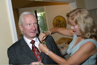 Susan putting on Lee's boutonnire